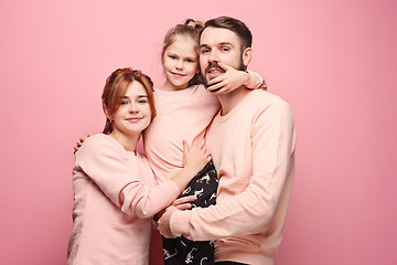 Image showing Happy young family with one little daughter posing together