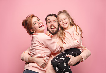 Image showing Happy young family with one little daughter posing together