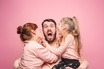 Image showing Happy young family with one little daughter posing together