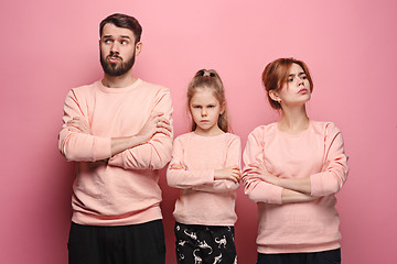 Image showing The sad family on pink