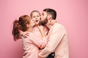 Image showing Happy young family with one little daughter posing together