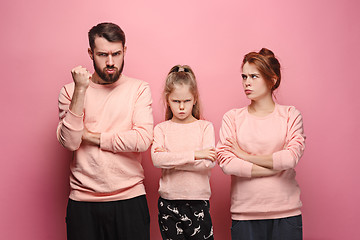 Image showing The sad family on pink