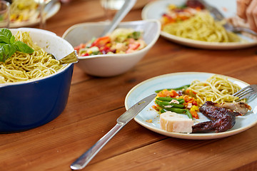 Image showing plate with food on wooden table