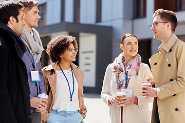 Image showing office workers with coffee on city street