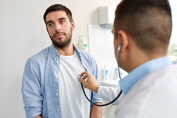 Image showing doctor with stethoscope and patient at hospital