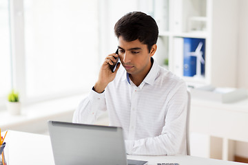 Image showing businessman calling on smartphone at office