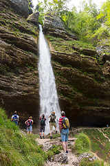 Image showing Active tourists looking at Pericnik waterfall in Vrata Valley in Triglav National Park in Julian Alps, Slovenia.