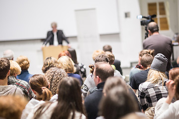 Image showing Business speaker giving a talk at business conference event.