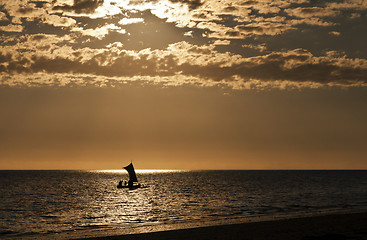 Image showing Silhouette of a boat (fishing pirogue) at sea. Madagascar