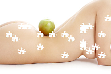 Image showing puzzle of woman torso with green apple