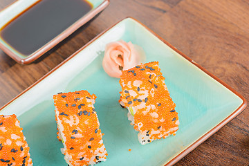 Image showing California maki sushi with masago, top view