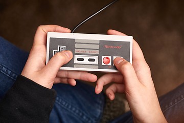 Image showing Nintengo NES,playing Super Mario 3