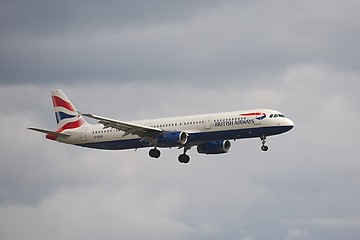 Image showing Plane landing in cloudy weather