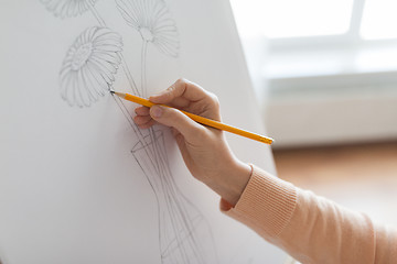 Image showing artist with pencil drawing picture at art studio