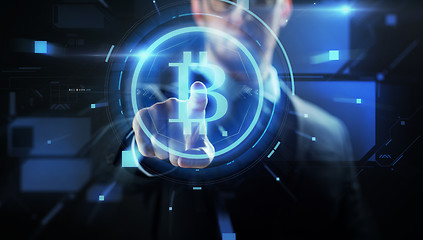 Image showing close up of businessman with bitcoin hologram