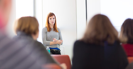 Image showing Woman giving presentation in lecture hall at university.