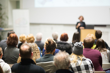 Image showing Woman giving presentation in lecture hall at university.