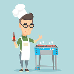 Image showing Man cooking steak on barbecue grill.