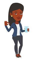 Image showing Young african-american woman taking pills.