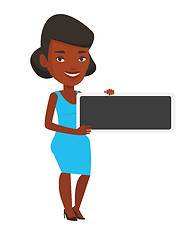 Image showing Young african-american woman holding blank board.