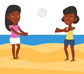 Image showing Two women playing beach volleyball.