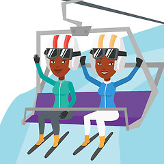 Image showing Two happy skiers using cableway at ski resort.