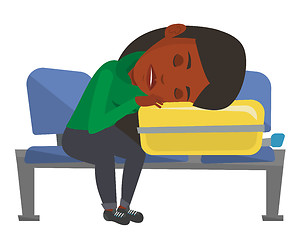 Image showing Exhausted woman sleeping on suitcase at airport.