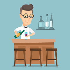 Image showing Bartender standing at the bar counter.