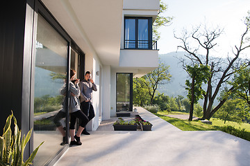 Image showing couple enjoying on the door of their luxury home villa