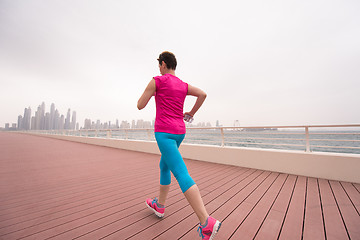 Image showing woman running on the promenade