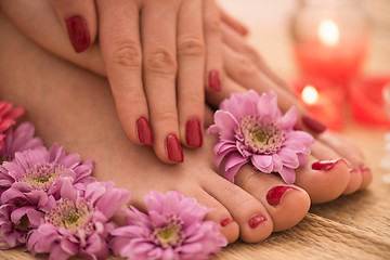 Image showing female feet and hands at spa salon