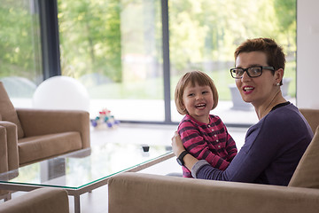 Image showing mother and cute little girl enjoying their free time