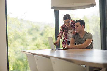 Image showing happy young couple buying online