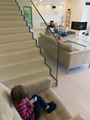 Image showing family with little girl enjoys in the modern living room