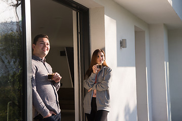Image showing couple enjoying on the door of their luxury home villa