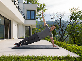 Image showing man doing morning yoga exercises