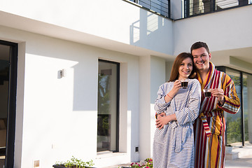 Image showing Young beautiful couple in bathrobes