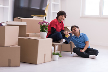 Image showing boys with cardboard boxes around them