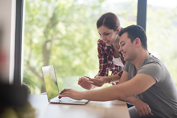 Image showing happy young couple buying online