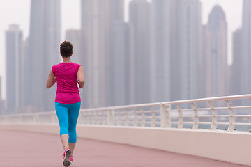 Image showing woman running on the promenade