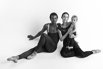 Image showing A happy family of ballet dancers on white studio background