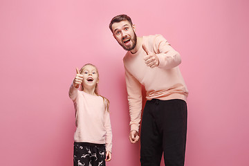 Image showing Young father with his baby daughter with thumb up