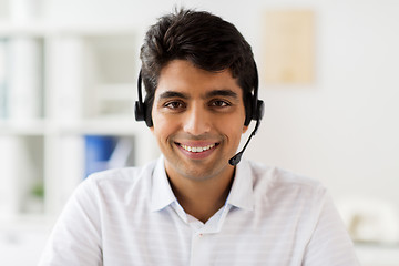 Image showing businessman in headset at office