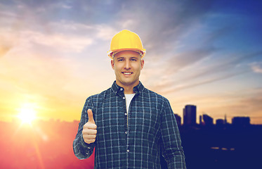 Image showing male builder in yellow hard hat showing thumbs up