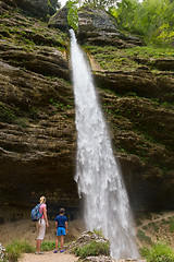 Image showing Active tourists looking at Pericnik waterfall in Vrata Valley in Triglav National Park in Julian Alps, Slovenia.