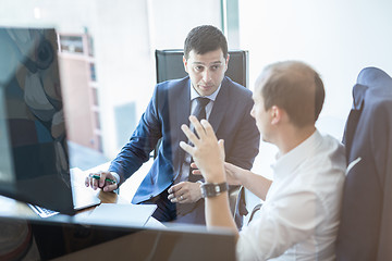 Image showing Business team brainstorming and dicussing business ideas at business meeting.