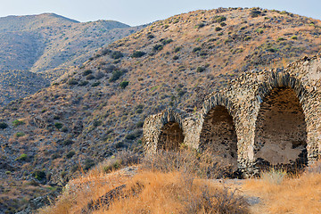 Image showing An ancient wall with an arch of stone