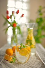 Image showing Fresh limes and lemonade on table