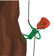 Image showing Man climbing in mountains with rope.