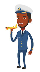 Image showing Cheerful airline pilot with model of airplane.